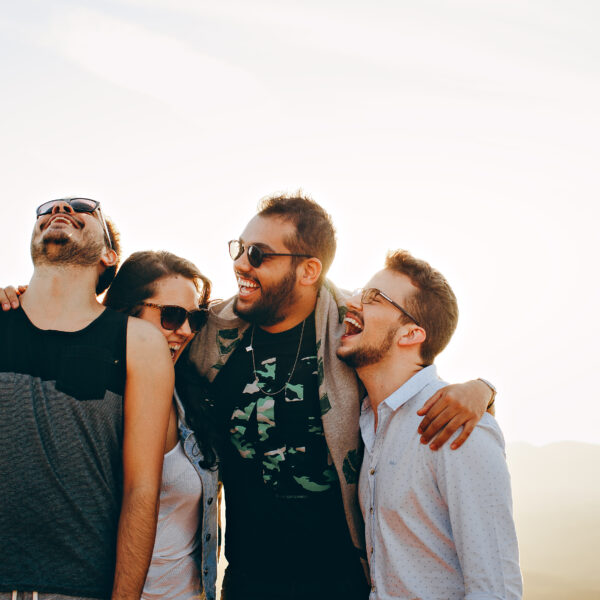 friends laughing on beach